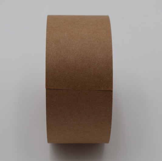 Brown kraft paper packing tape roll showing biodegradable paper texture